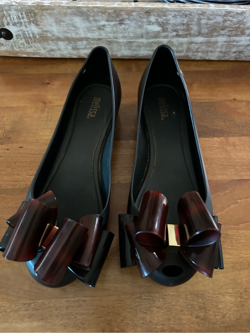 Melissa Black Jelly Flats with Dark Burgundy Bow and Gold Accent
